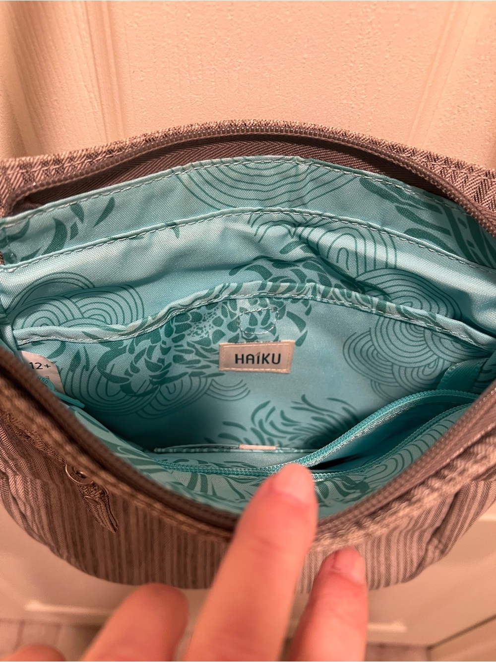 Haiku Jaunt Crossbody Purse in a Gray Striped Pattern. - Picture 4 of 10